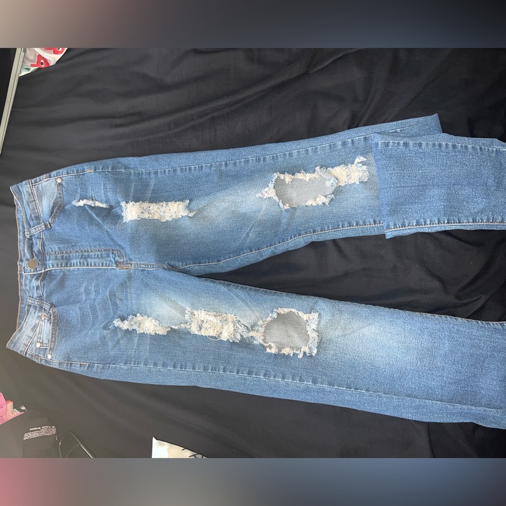 Ripped medium blue jeans